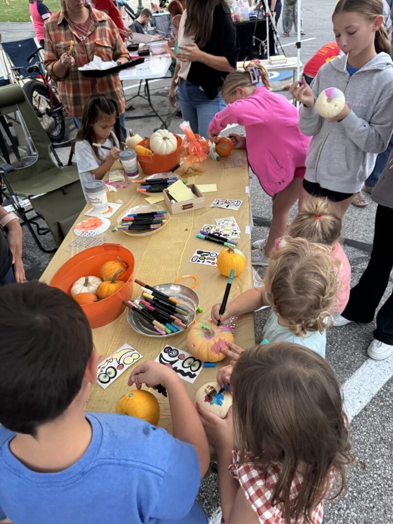 Children painting pumpkins at Columbia City Connect's First Friday Event