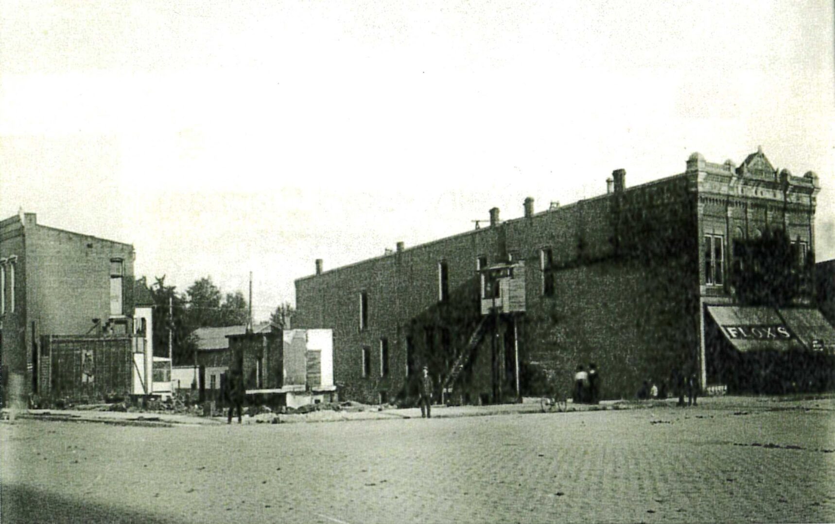 Photograph showing the empty lot where buildings burned down in the Washburn Block fire. 