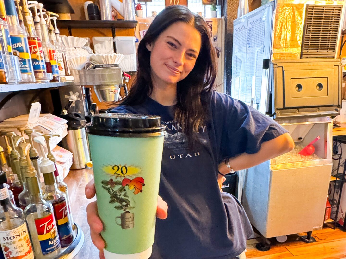 Brewha Barista serving a coffee with a smile